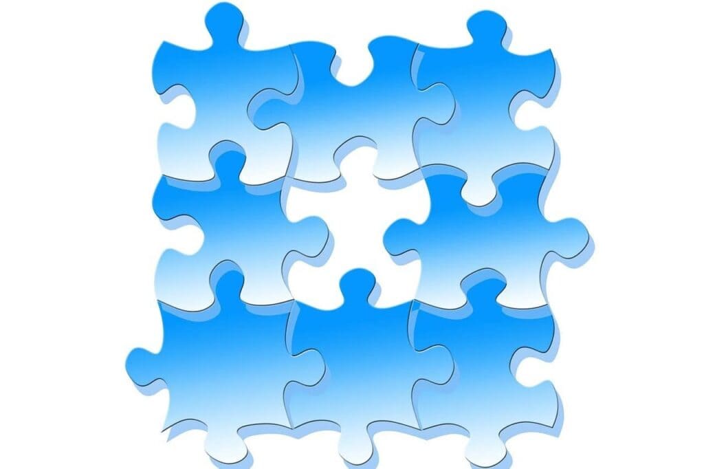 Grafik mit Puzzleteilen, die Artikel zum Thema "Tätigkeiten im Lebenslauf zusammenfassen" symbolisieren soll