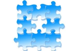 Grafik mit Puzzleteilen, die Artikel zum Thema "Tätigkeiten im Lebenslauf zusammenfassen" symbolisieren soll